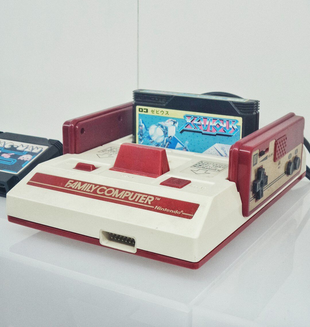 Stack of retro video game cartridges and cases