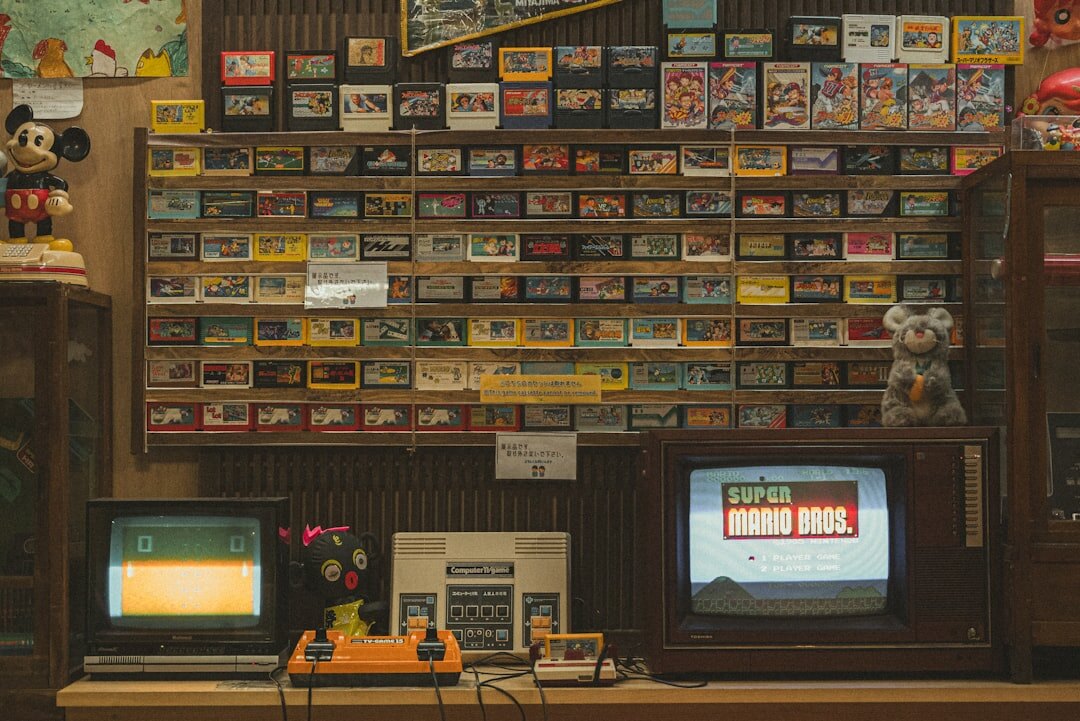 Group of retro gaming enthusiasts gathered around vintage consoles