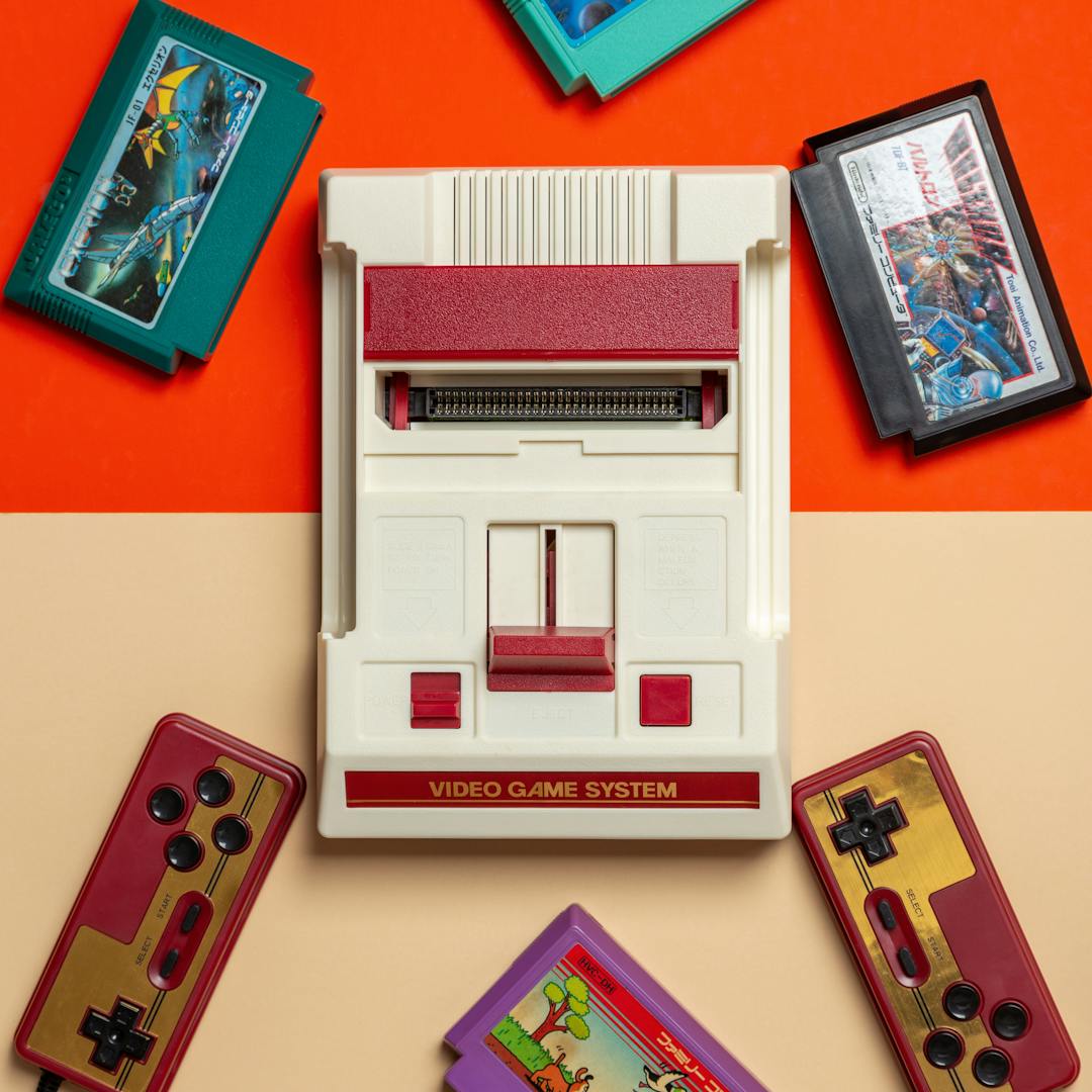 flat lay of vintage console with colourful cartridges