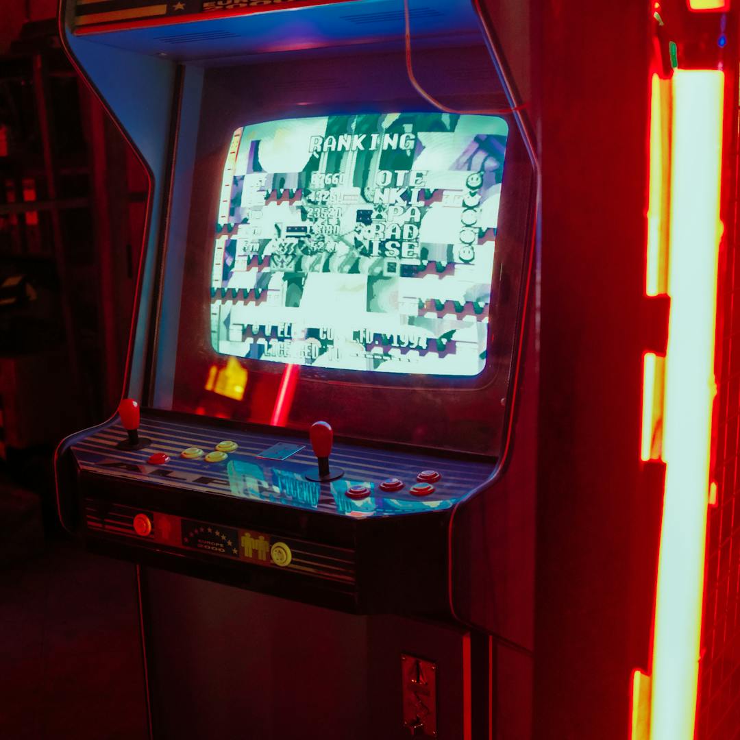 arcade machine lit by neon